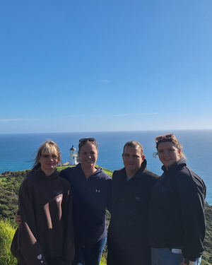Family n outdoor adventure by lighthouse and ocean